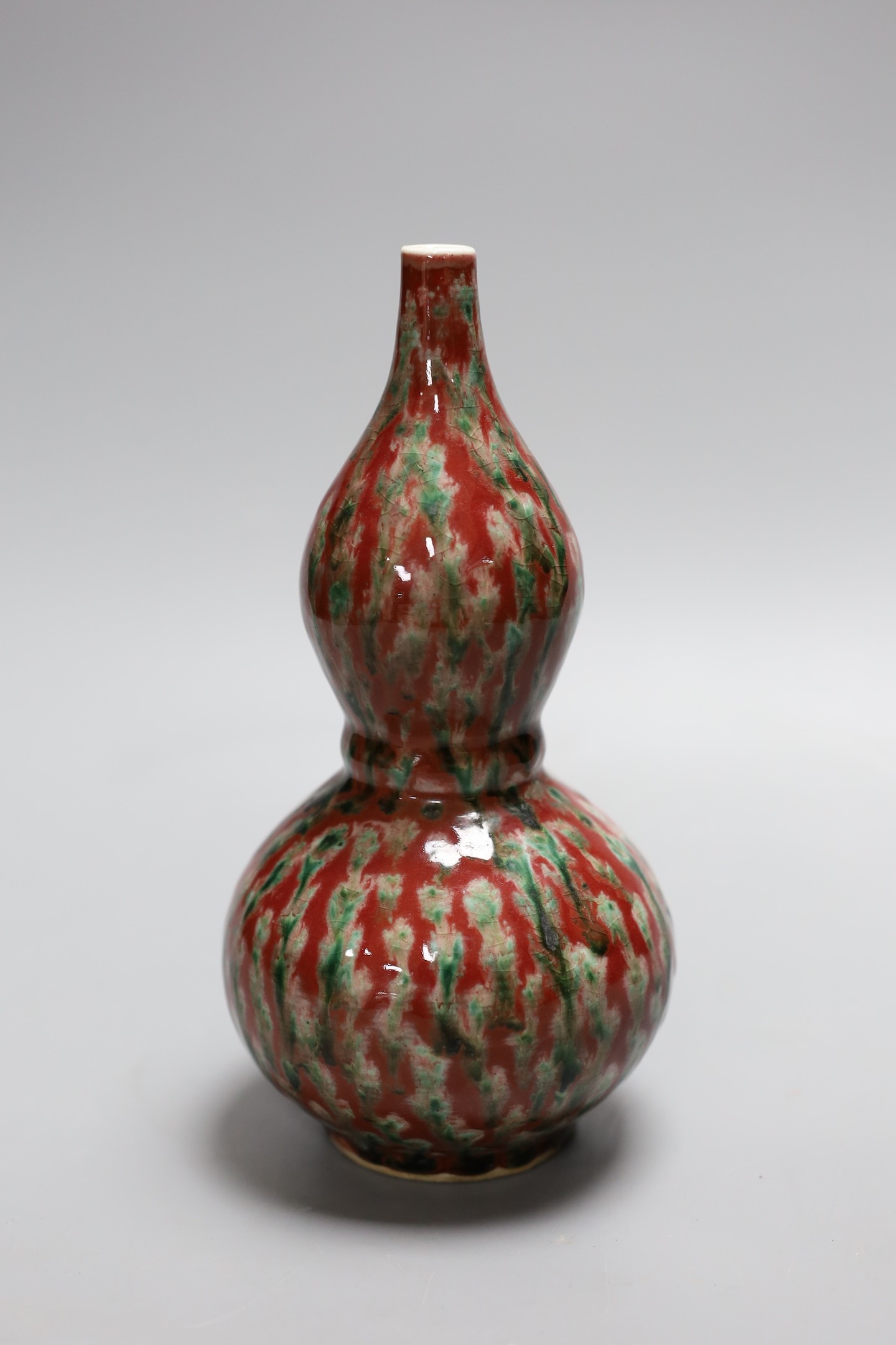 A Chinese flambé double gourd vase, 21 cms high